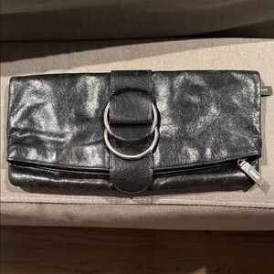 HOBO International Black Leather Clutch with Silver Accents. Floral lining